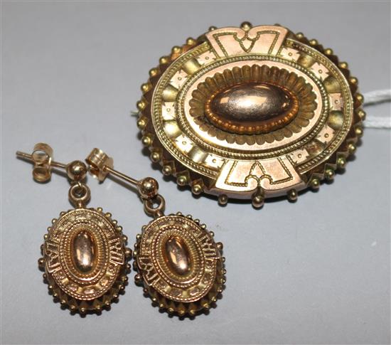 A Victorian yellow metal brooch and matching earrings.